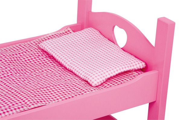 Bijpassend roze geruit beddengoed.